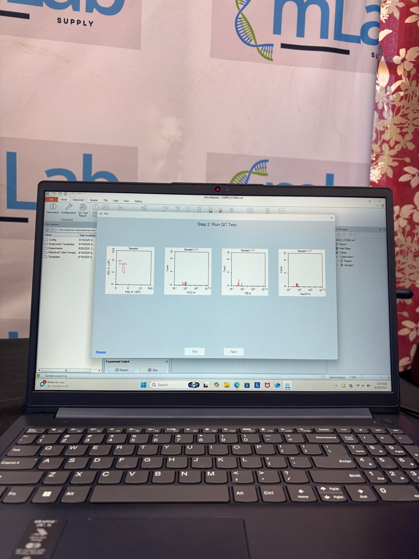 Open laptop displaying a software interface on a floral-patterned surface