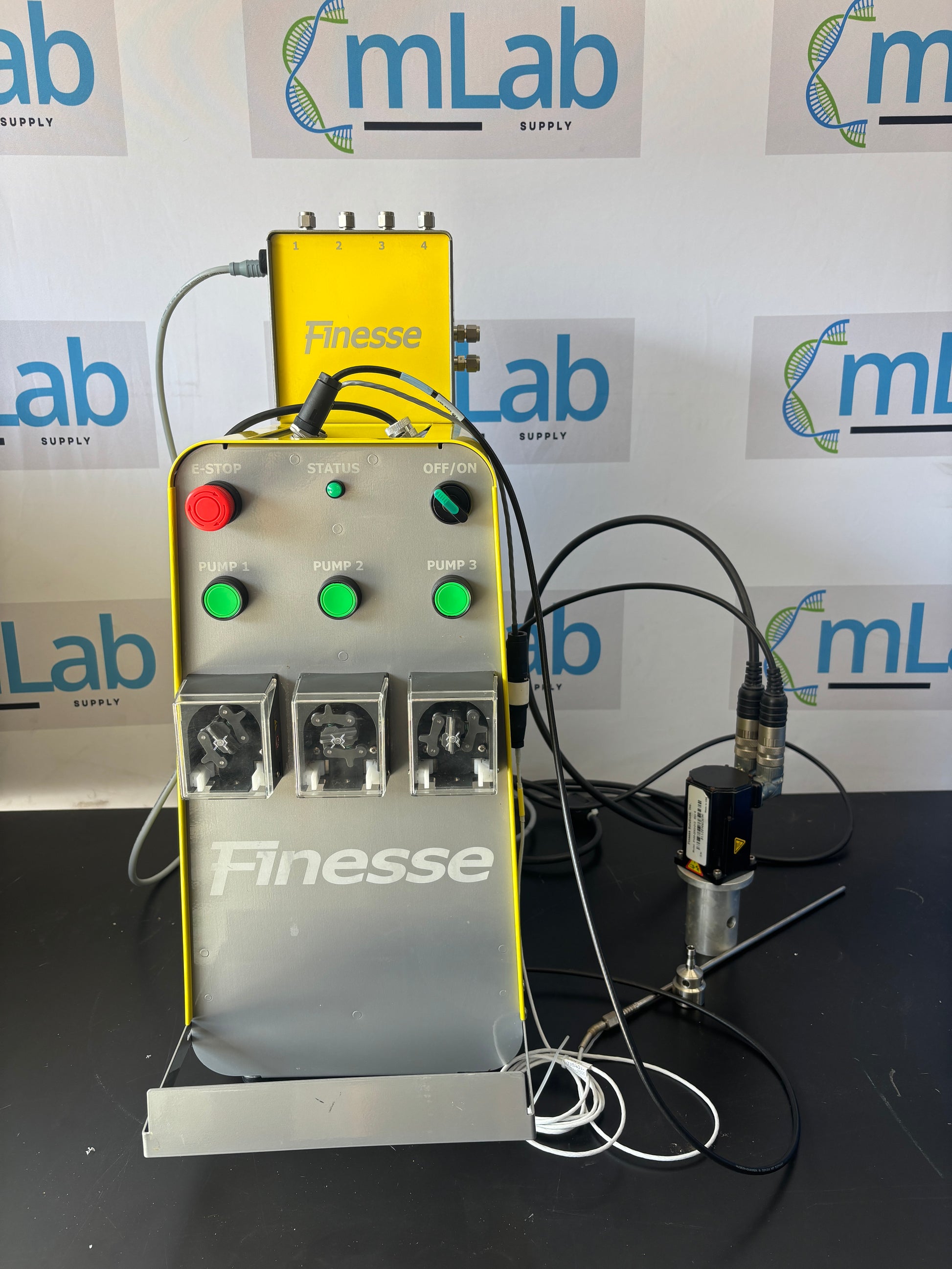 Electronic device with wires and buttons on a background with 'mLab' branding.