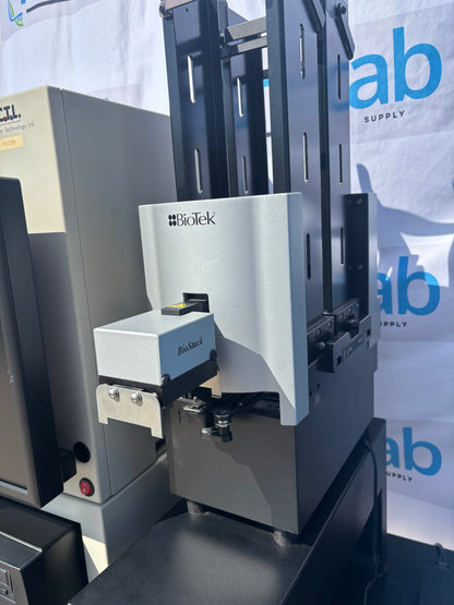 Close-up of a printing machine with 'Ricoh' branding, set against a backdrop with 'Qibek Supply' branding.