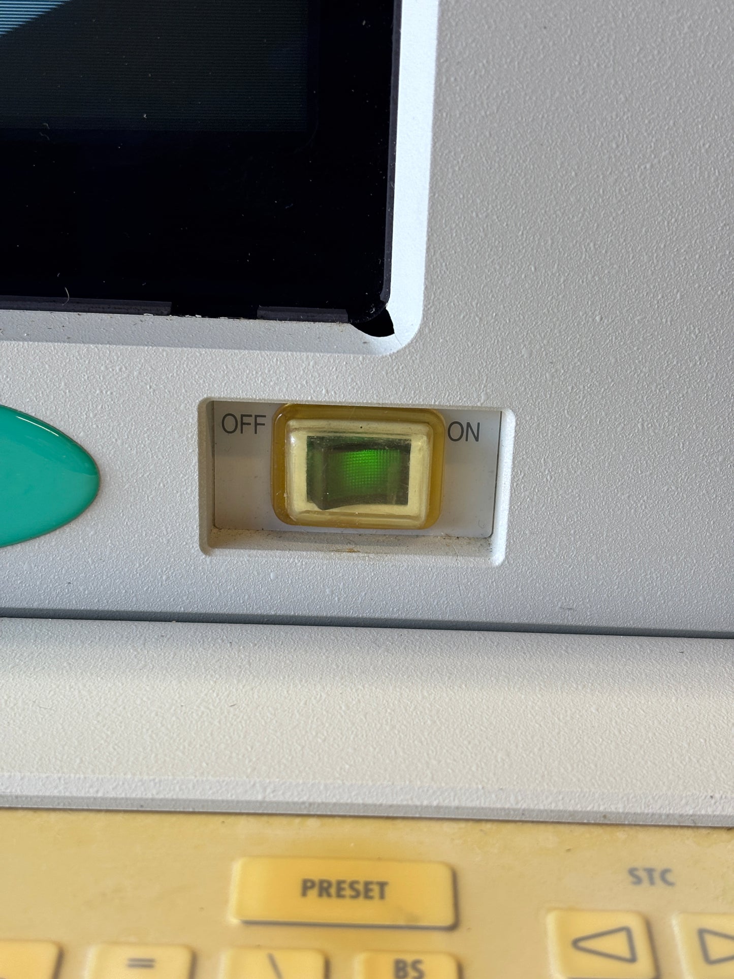 Control panel with a green light indicator on a gray background