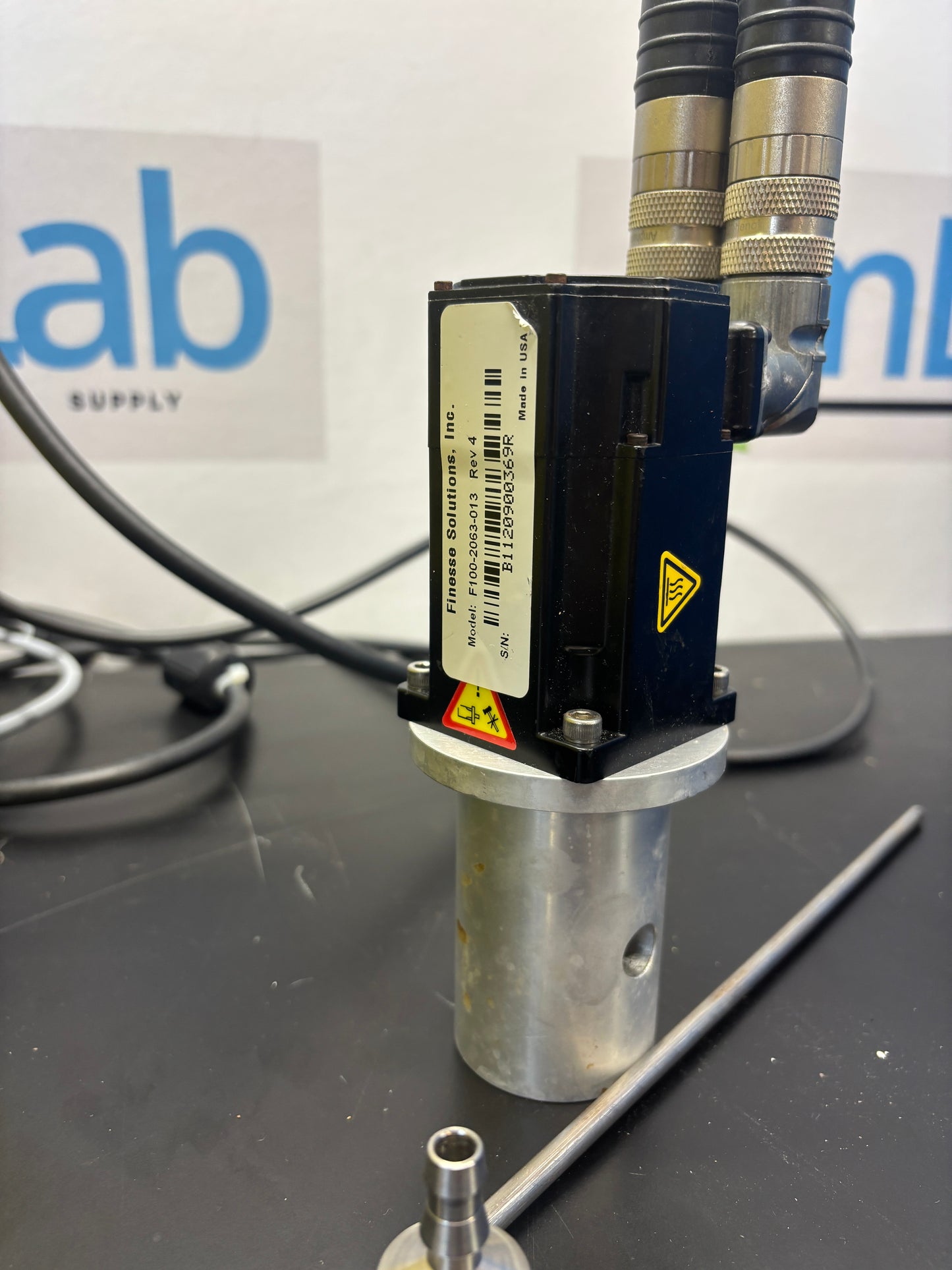 Mechanical component with visible branding on a dark background