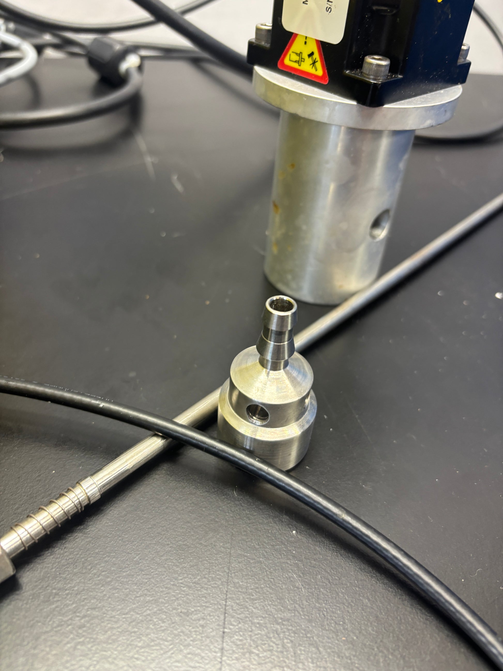 Close-up of a tool being used on a bicycle rim.