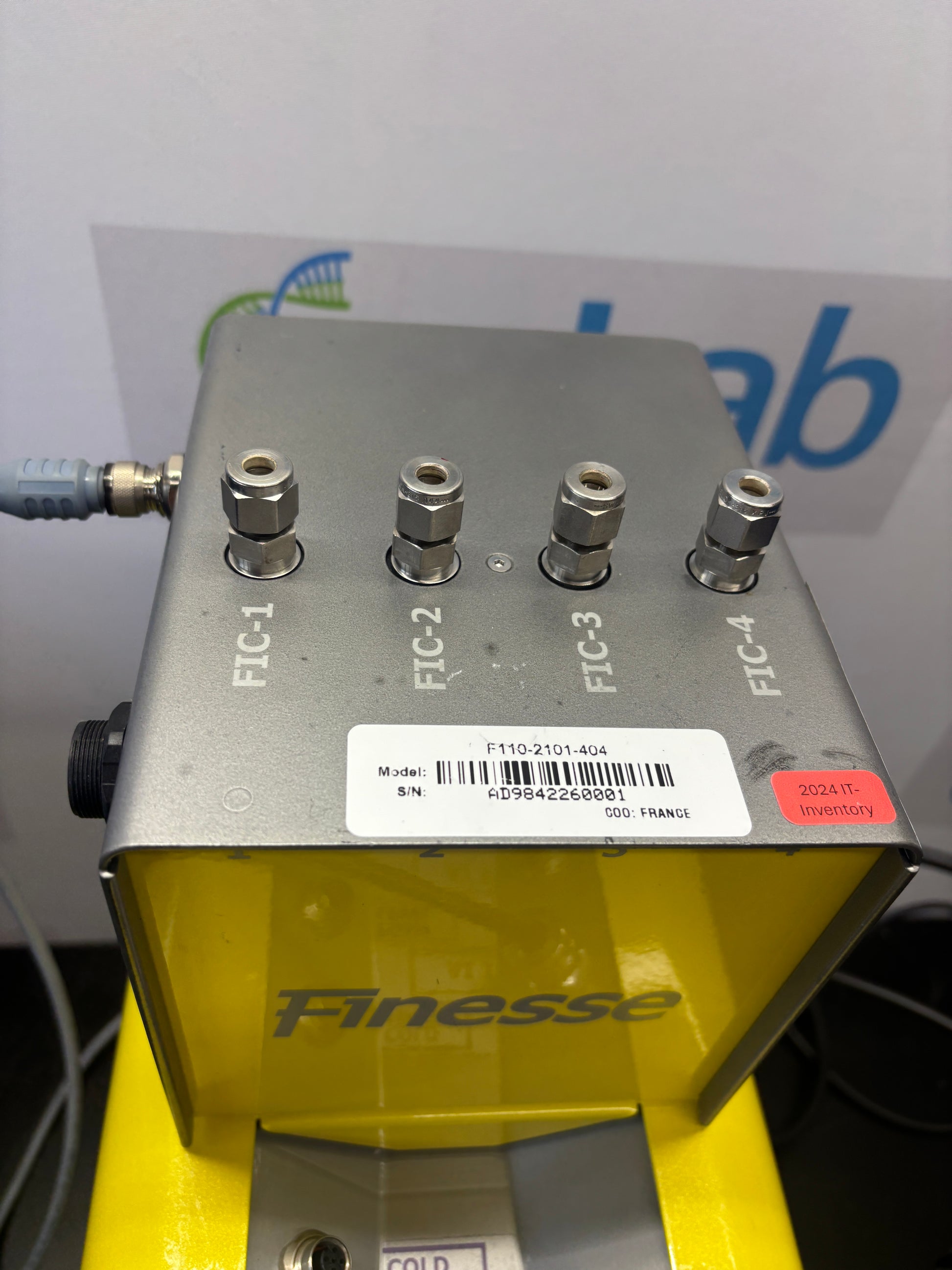 Electronic device with labeled ports and 'Finesse' branding on a white background