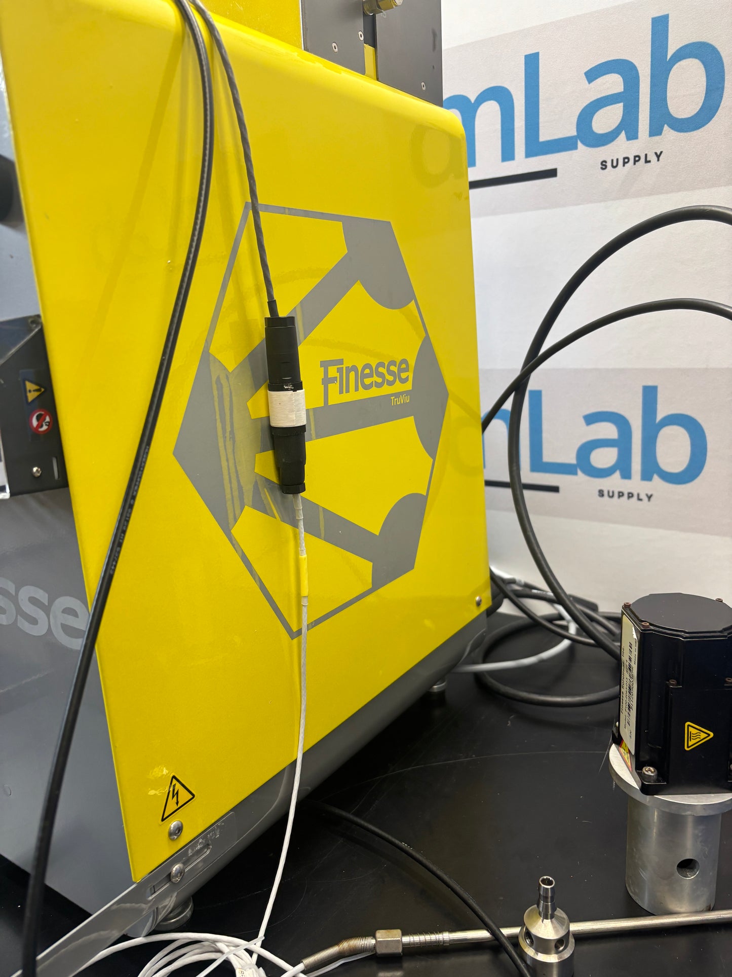 Yellow machine with 'Finesse' branding on a 'Lab Supply' background
