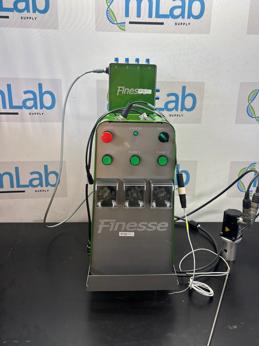 Finesse machine on a dark surface with 'mLab' branding in the background