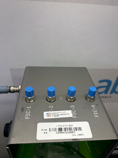 Control panel with blue knobs and a label on a gray background