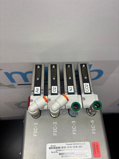 Control panel with multiple ports and labels on a white wall