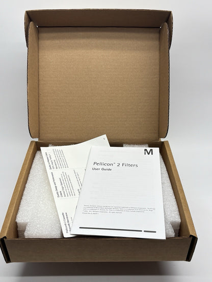 Open cardboard box with Pellicon 2 Filters user guide and documents on a white background