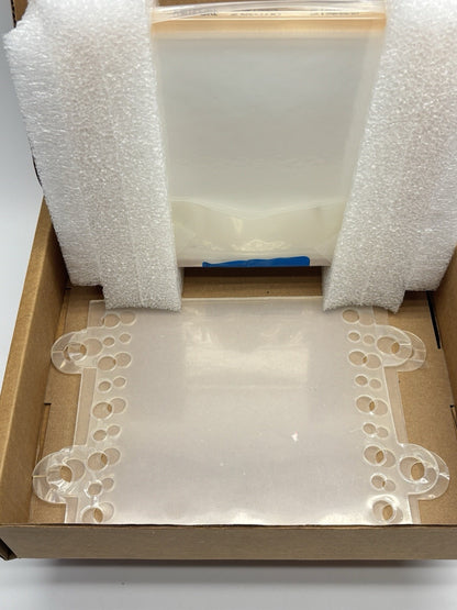 Lab Equipment available in San Diego biotech lab Box with bubble wrap and a decorative corner piece on a white surface
