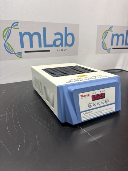 Thermocycler on a lab bench with 'mLab Supply' branding in the background