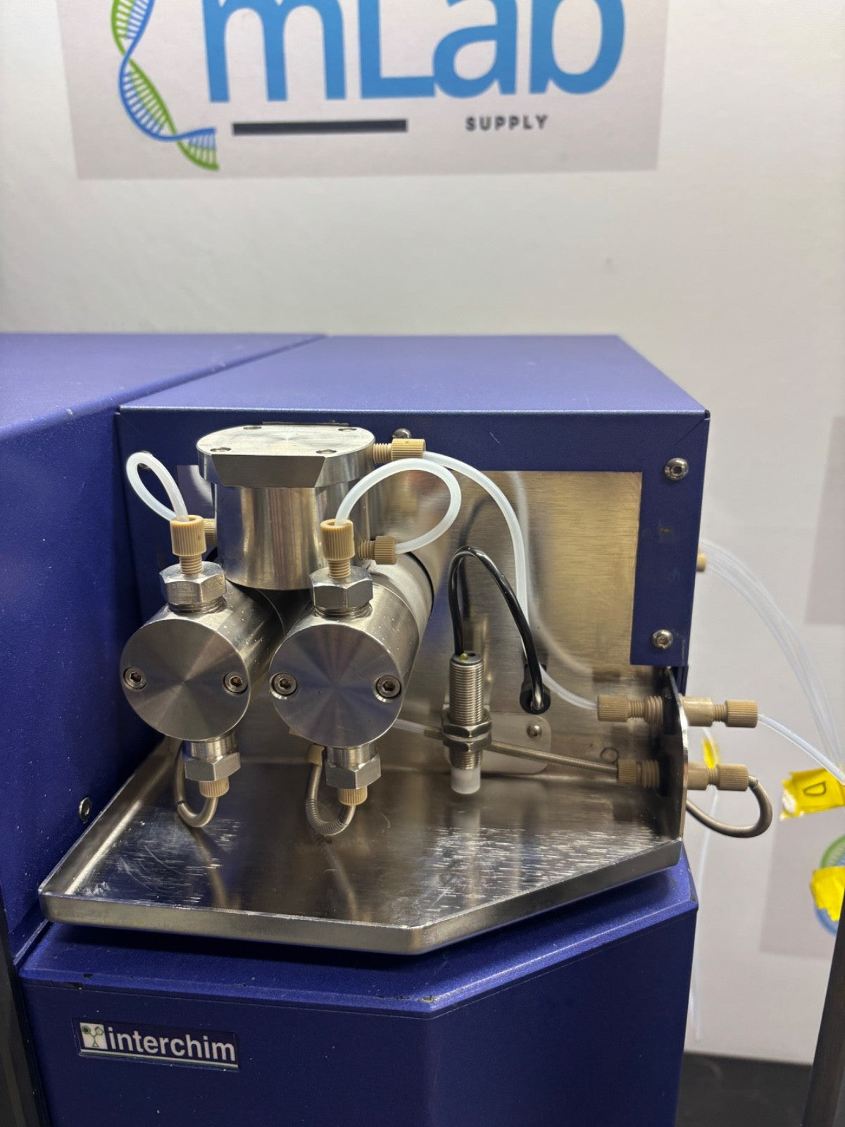 Lab equipment with 'mLab Supply' and 'interchim' branding on a white background